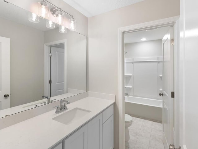 full bathroom featuring vanity, bathtub / shower combination, and toilet