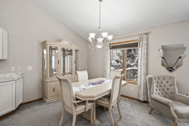 carpeted dining space featuring vaulted ceiling and a notable chandelier