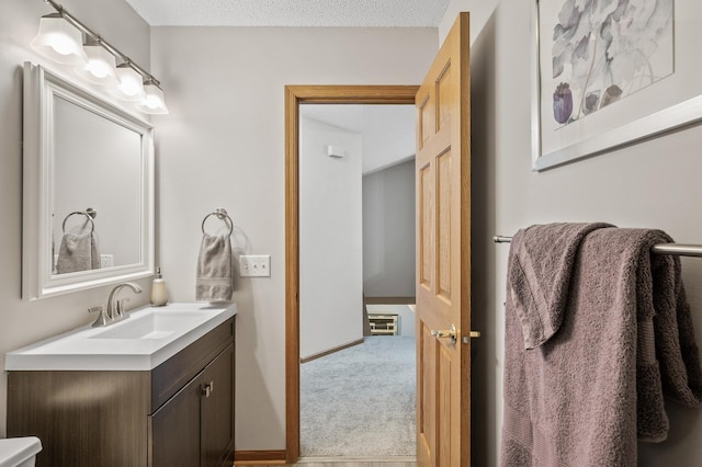 bathroom featuring vanity and a textured ceiling