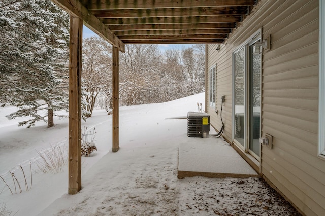 yard covered in snow featuring cooling unit