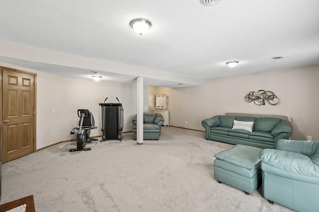 living room with carpet floors and a textured ceiling