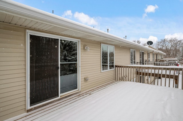 view of snow covered deck