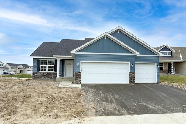 craftsman-style home with a garage