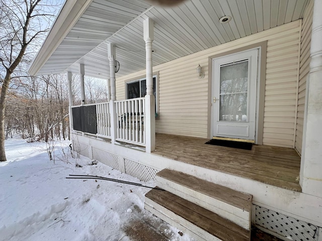 view of snow covered deck