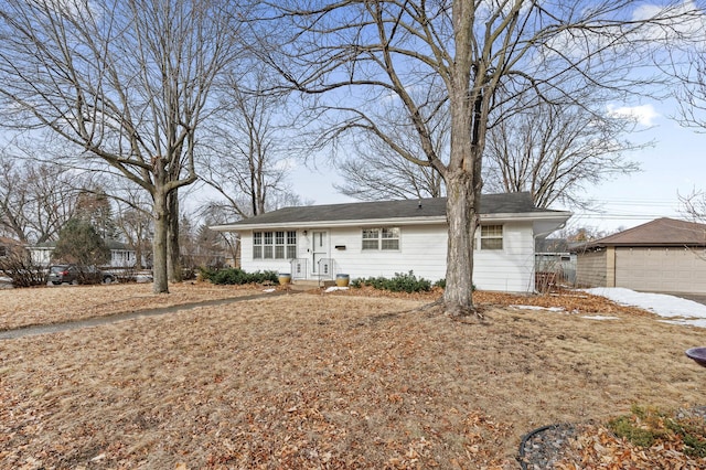 ranch-style house with an outbuilding and a garage