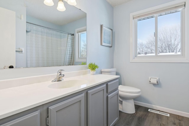 bathroom featuring an inviting chandelier, vanity, toilet, hardwood / wood-style flooring, and a shower with shower curtain