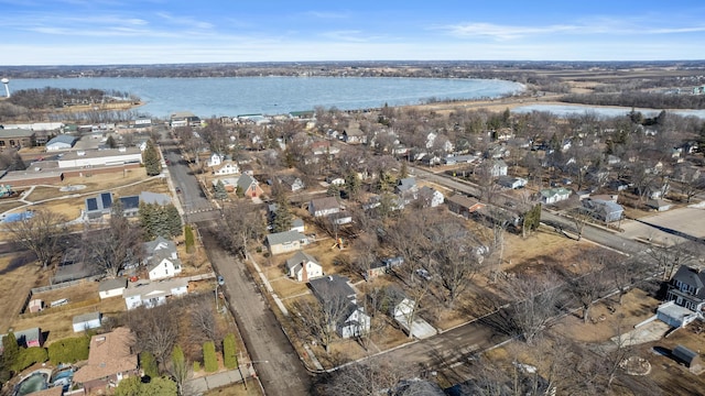 birds eye view of property featuring a water view and a residential view