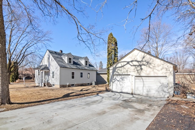 view of property exterior featuring a garage, an outbuilding, a chimney, and entry steps