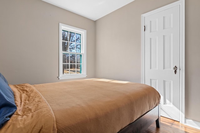 bedroom with wood finished floors