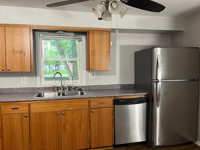 kitchen featuring appliances with stainless steel finishes, sink, and ceiling fan