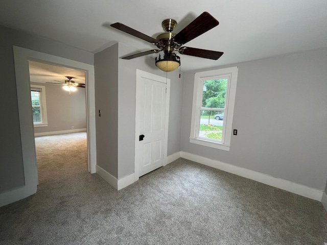 unfurnished bedroom featuring a closet, ceiling fan, and carpet flooring