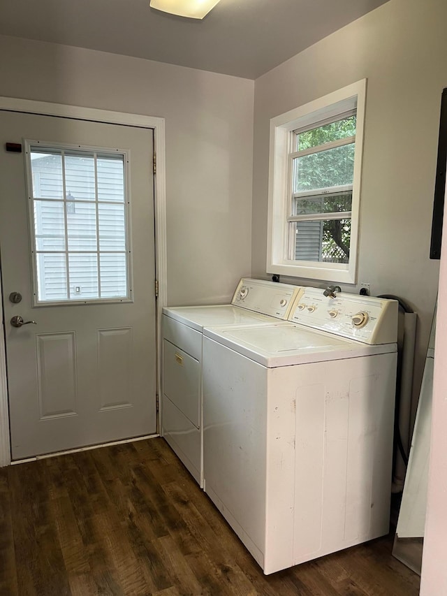 washroom featuring separate washer and dryer and dark hardwood / wood-style flooring