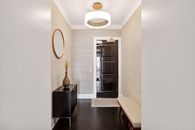 foyer featuring crown molding and hardwood / wood-style flooring