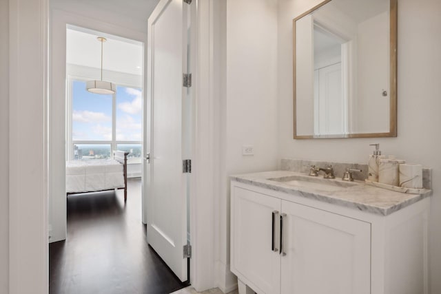 bathroom featuring vanity and hardwood / wood-style flooring