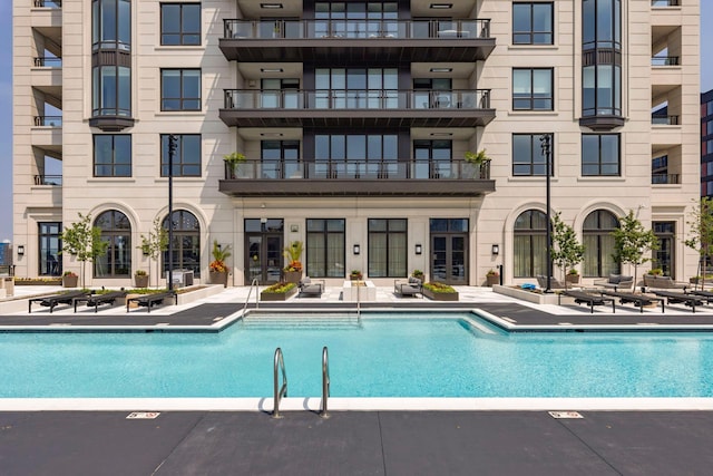 view of swimming pool with a patio area