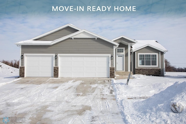 view of front of property featuring stone siding and an attached garage