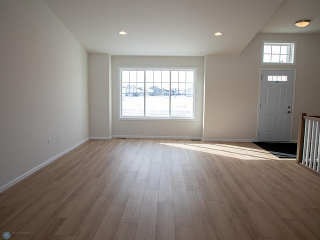 entrance foyer with recessed lighting, wood finished floors, and baseboards