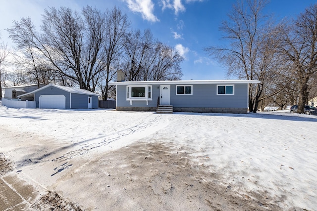 view of front of home with an outbuilding and a garage