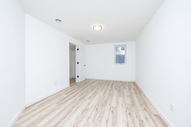 spare room featuring light hardwood / wood-style flooring