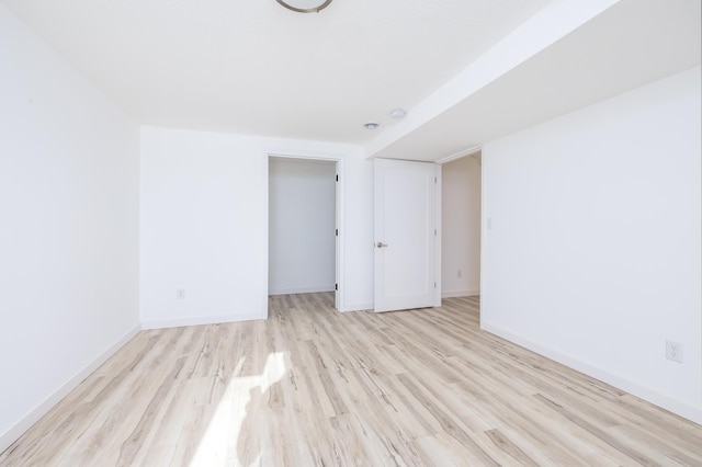 spare room with light hardwood / wood-style floors