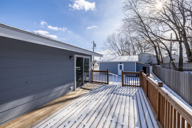 wooden deck with a storage shed