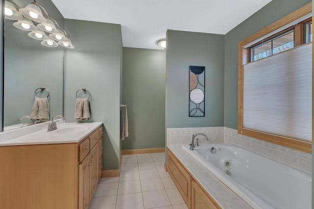 bathroom with vanity, tile patterned floors, and a tub to relax in