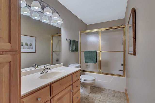 full bathroom with vanity, toilet, tile patterned flooring, and combined bath / shower with glass door