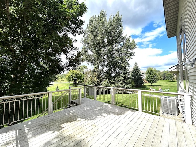 wooden terrace with central AC and a lawn