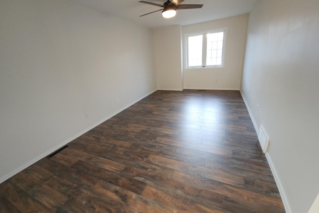 unfurnished room with dark hardwood / wood-style floors and ceiling fan