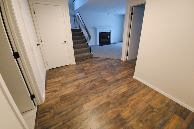 corridor featuring dark hardwood / wood-style flooring