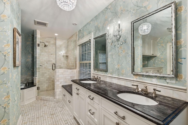 5231 Clinton Ave, Minneapolis, MN 55419 - full bath featuring a sink, visible vents, a stall shower, and a notable chandelier
