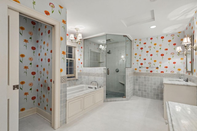 5231 Clinton Ave, Minneapolis, MN 55419 - full bathroom featuring a garden tub, tile patterned flooring, a shower stall, vanity, and wallpapered walls