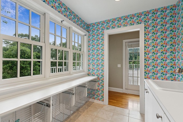 5231 Clinton Ave, Minneapolis, MN 55419 - interior space featuring a sink, baseboards, wallpapered walls, and cabinet space
