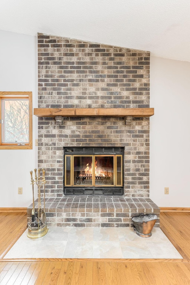 room details featuring hardwood / wood-style flooring and a fireplace