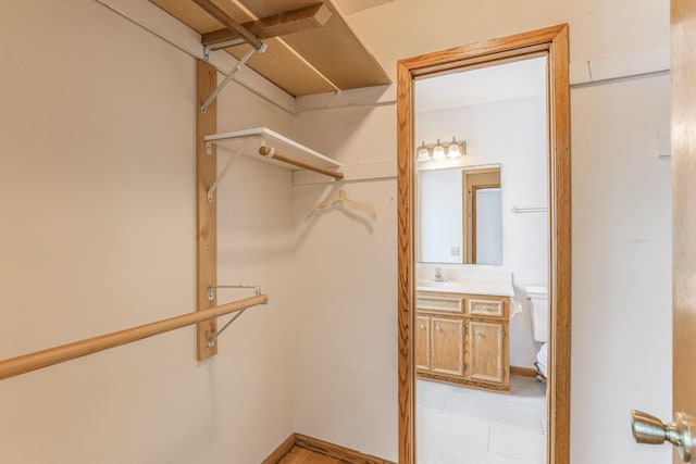 walk in closet with sink