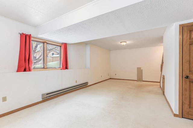 spare room featuring a textured ceiling and baseboard heating