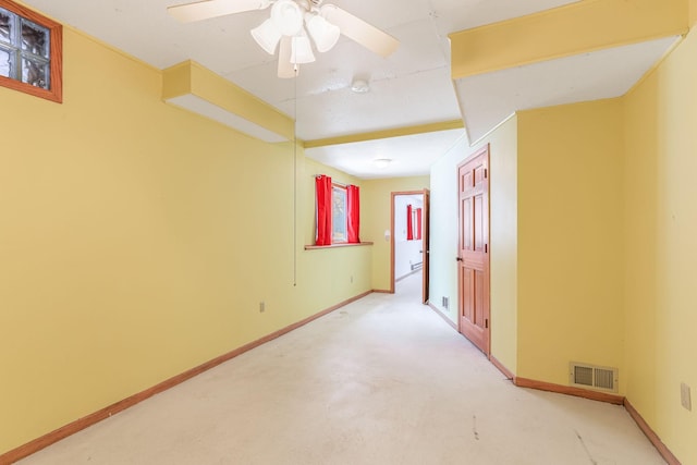 carpeted empty room with ceiling fan