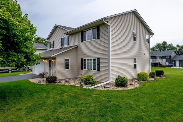 view of property exterior with a garage and a lawn