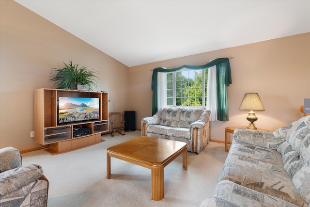 living room with vaulted ceiling and light colored carpet