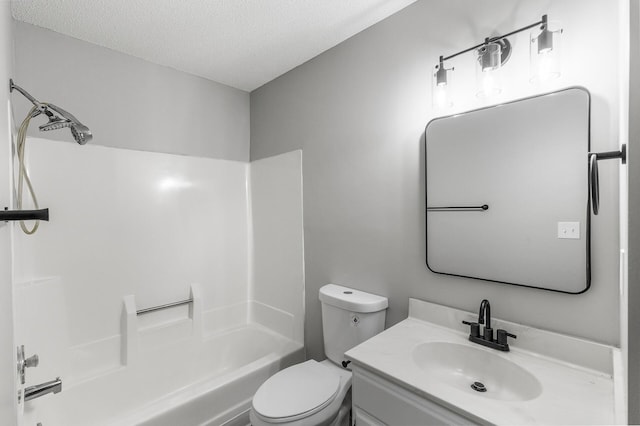 full bathroom with vanity, a textured ceiling, shower / washtub combination, and toilet