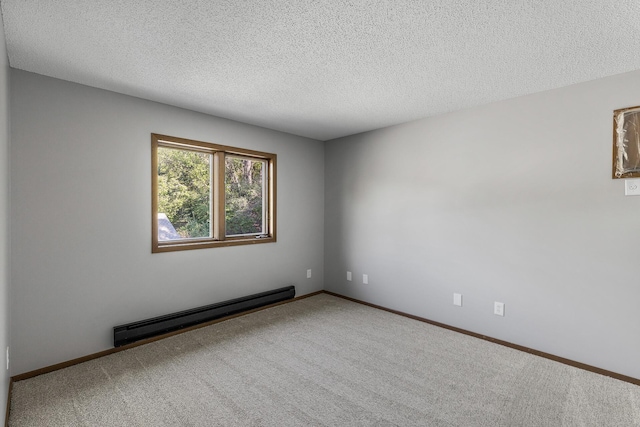 empty room featuring carpet flooring, a textured ceiling, and baseboard heating