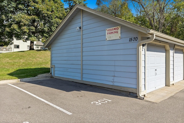 garage featuring a yard