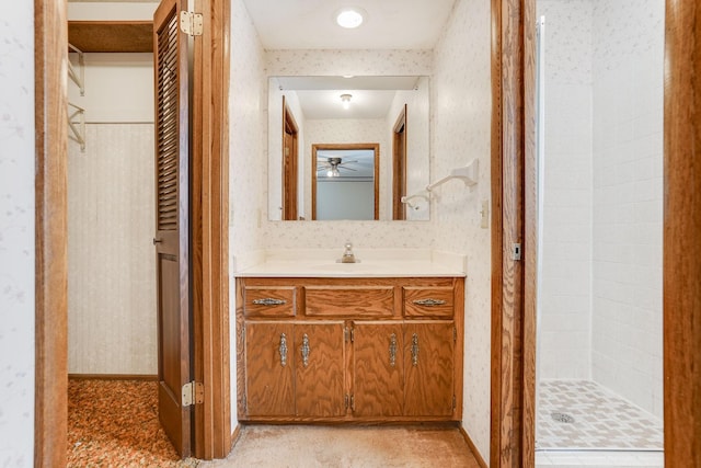 bathroom featuring vanity and tiled shower