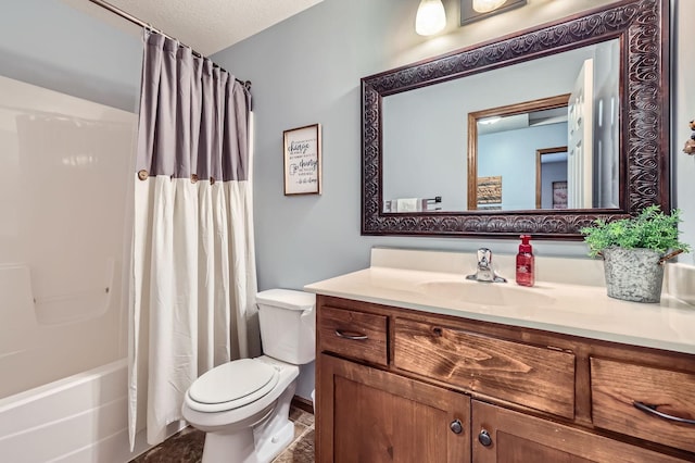 bathroom featuring shower / bath combo with shower curtain, a textured ceiling, toilet, and vanity