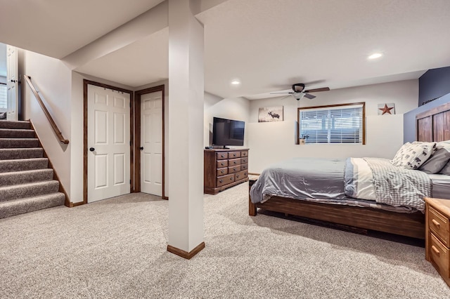 bedroom featuring recessed lighting, baseboards, light colored carpet, and a ceiling fan