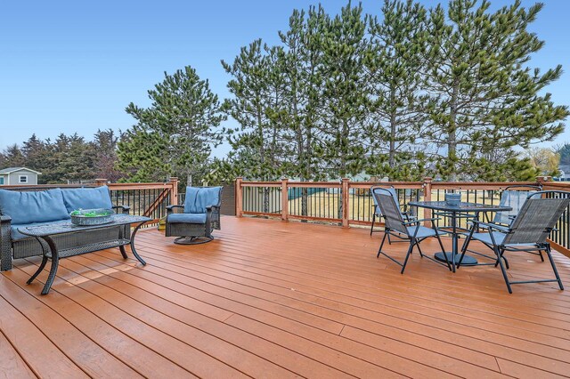 wooden deck featuring outdoor dining space