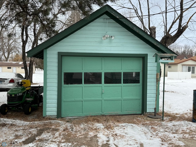 view of snow covered garage