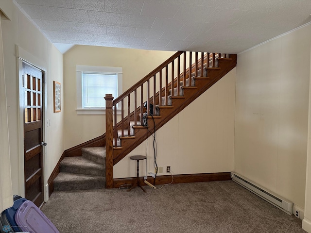 stairs with lofted ceiling, carpet floors, and baseboard heating