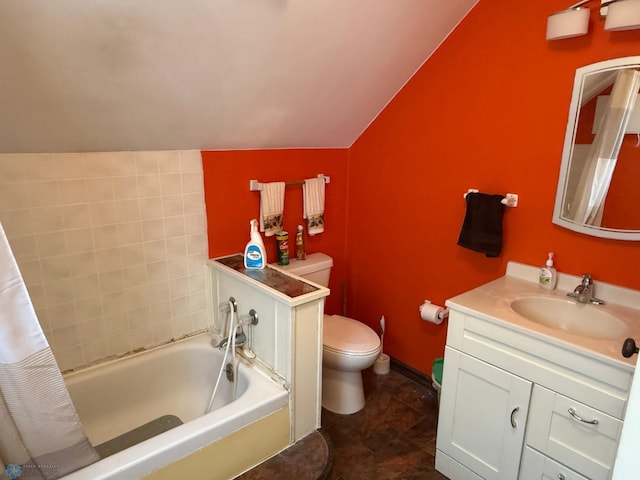 bathroom featuring vanity, a bathtub, vaulted ceiling, and toilet