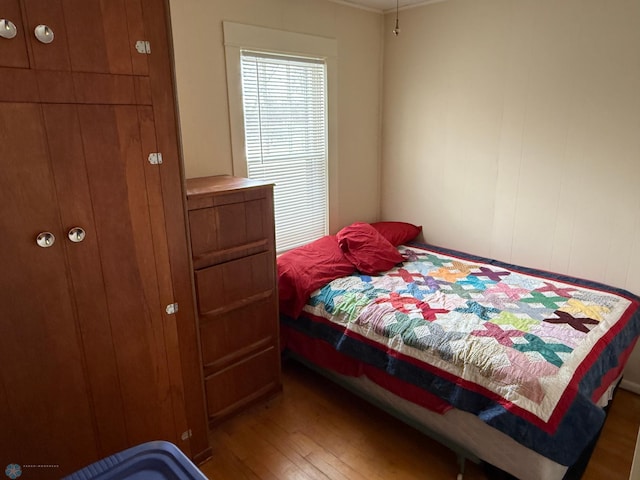 bedroom with wood-type flooring